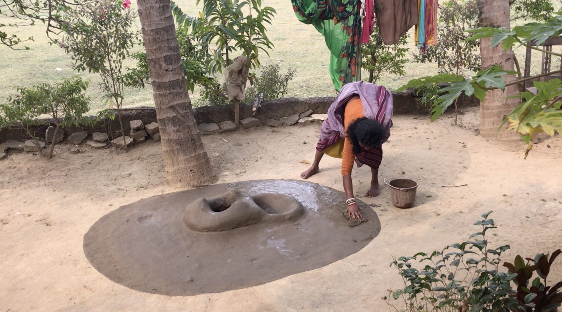 Indian woman washing the stove